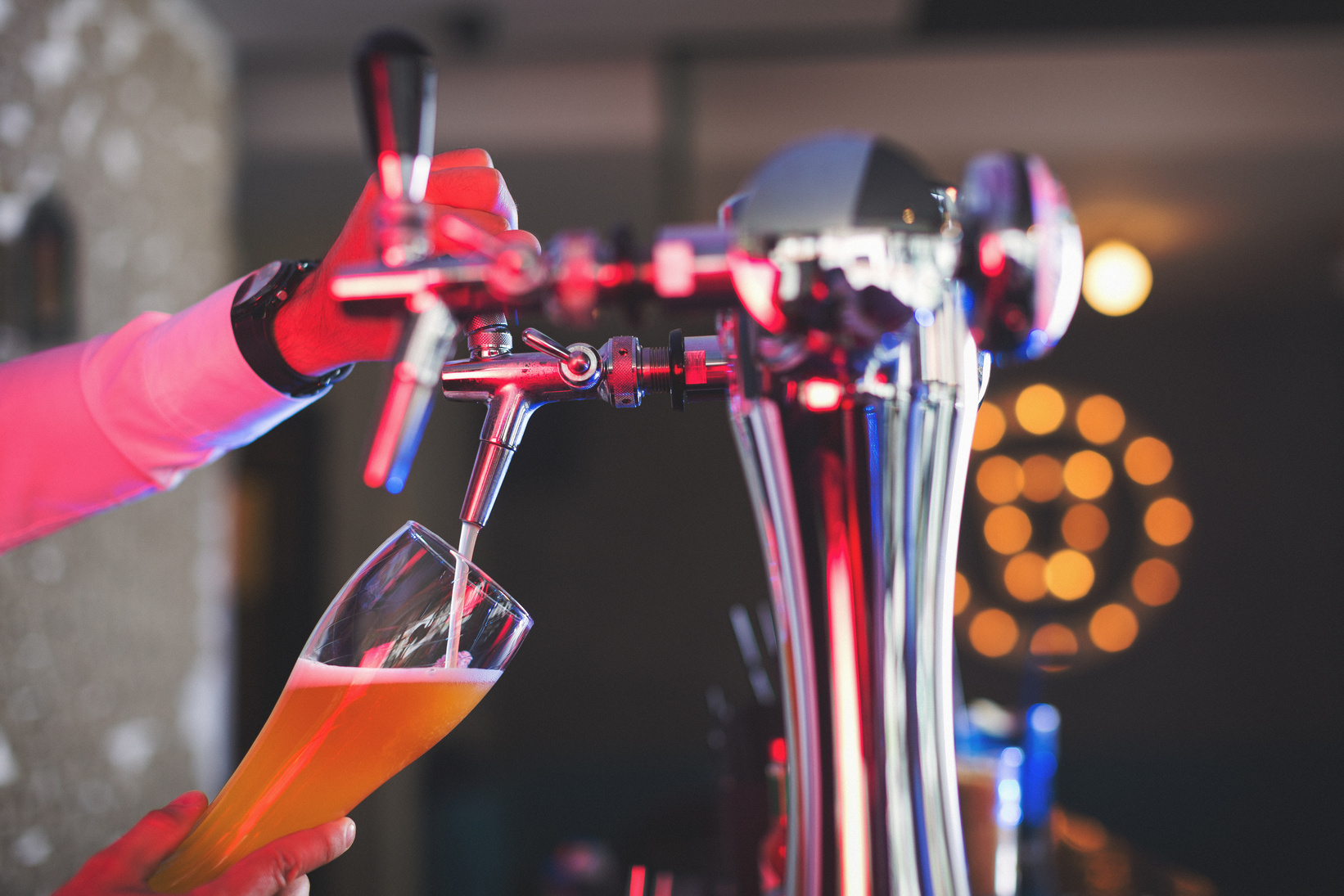 Bartender serving draft beer